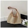 Large beige woven straw tote bag with brown leather straps in a minimalist setting - Brown