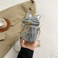 Silver chain bucket bag with large bow detail and quilted heart pendant design - Silver