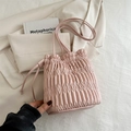 Chic pink pleated drawstring bucket bag with soft ruching and matching shoulder strap - Pink