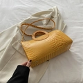 Bright yellow crocodile pattern crossbody bag with circular cutout handle and strap - Yellow