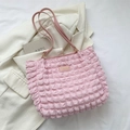Pink popcorn textured tote bag with top handles and a fashion metal brand label - Pink