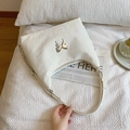 Elegante borsa tote in pelle bianca con farfalla argentata e tracolla a catena - Bianco Sporco