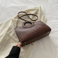 Dark brown faux leather crossbody bag with crocodile texture and round top handle - Brown