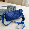 Royal blue quilted nylon crossbody pillow bag with adjustable strap and fashion label - Blue