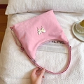 Pink quilted hobo bag with silver butterfly charm and chain strap in Y2K aesthetic - Pink