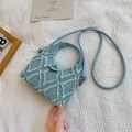 Light blue denim crossbody bag with frayed diamond stitching and metal twist lock detail - Light Blue