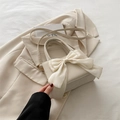 Elegant cream white PU leather crossbody bag with a large decorative silk-texture bow - White