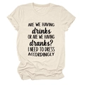 Detail of cream crewneck tee with humorous 'ARE WE HAVING drinks' slogan and cotton texture - Sand (Black Font)