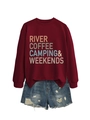 Detail of burgundy crewneck sweatshirt with 'RIVER COFFEE CAMPING' text and denim shorts - Burgundy