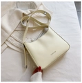 Minimalist beige leather crossbody bag with adjustable strap and metal hardware - White