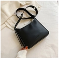 Minimalist black matte leather underarm shoulder bag with adjustable strap and logo detail - Black