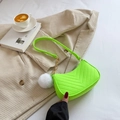 Neon green V-quilted shoulder bag with gold chain and plush ball on a beige background - Light Green