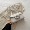 Elegant white faux leather handbag with a sparkling silver rhinestone bow decoration - White