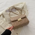 Elegant beige quilted crossbody bag with gold chain strap and metal turn-lock closure - Khaki