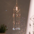 Suncatcher crystal ornament with geometric gold frame and pink quartz casting rainbow prisms - Flight to Moon Pyramid Suncatcher