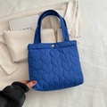 Royal blue quilted tote bag with heart patterns and gold metal snap closure - Blue