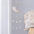 Detailed view of bohemian gold moon suncatcher with raw crystals and white sheer curtain - Immortal Realm Dark Moon