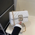 White quilted crossbody bag with gold chain strap and stylish metallic twist lock - White