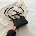 Minimalist black faux leather mini tote bag with dual handles and gold strap hardware - Black