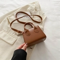 Minimalist brown leather mini crossbody bag with adjustable strap and top handle - Brown