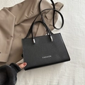 Elegant black lychee grain rectangle crossbody bag with silver Fashion logo lettering - Black