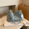 Sky blue bubble pleated underarm bag with decorative floral charm and knot handles - Blue