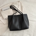 Minimalist black matte leather tote bag with vertical stitching for elegant commuting - Black