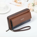 Detailed view of brown litchi grain leather clutch with stylish printed fabric and wristlet - Blue