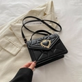 Elegant black quilted PU leather crossbody bag with iconic golden heart crown lock - Black