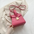 Pink faux crocodile leather handbag with gold clasp and adjustable shoulder strap - Pink