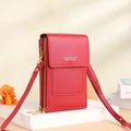 Detail of red touchscreen phone bag with lychee grain texture and dual zipper compartments - Red