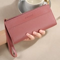 Women's long bifold wallet in dusty pink litchi grain leather with wristlet strap - Pink