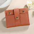Brown bifold short wallet with lychee texture PU leather and gold snap button closure - Brown