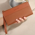 Elegant brown pebbled leather long wallet with zipper and wrist strap detail - Brown