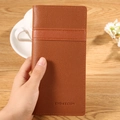 Portefeuille long en cuir marron avec texture litchi et logo en décor de vie - Marron