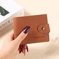 Brown grainy leather folding card wallet with gold buckle closure and brand embossing - Brown
