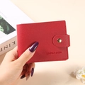 Red lychee grain leather short wallet with golden buckle and card slots for women - Red