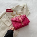 Chic magenta quilted crossbody bag with golden SS logo and elegant tassel detail - Rose Pink
