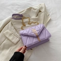 Lavender quilted leather crossbody bag with V-shaped stitching and gold chain strap - Purple