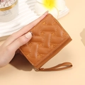 Brown trifold wallet with quilted heart embroidery and gold zipper wristlet strap - Brown