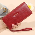 Cartera larga de mujer en cuero rojo con cremallera dorada y correa de muñeca - Rojo