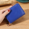 Royal blue RFID blocking leather card wallet with double gold zippers in a hand - Blue