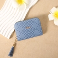 Detailed shot of blue checkered embossed wallet with leather tassel and metal logo - Blue