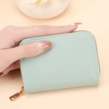 Light green mint leather card holder with gold zipper and minimalist stitching - Green