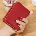Red lychee grain PU leather card holder with dual golden zippers for secure storage - Red