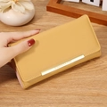 Long mustard yellow bifold wallet for women with gold logo bar and multi-slot design - Yellow