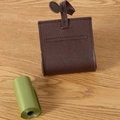 Dark brown leather pet poop bag dispenser with litchi texture and hanging strap - Coffee