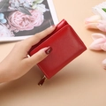 Short red tri-fold leather wallet for women with golden zipper and textured finish - Red