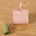 Pink leather dog poop bag holder with matching strap and green waste bag roll - Pink
