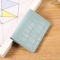 Minimalist light blue faux leather wallet with crocodile pattern and snap button - Blue